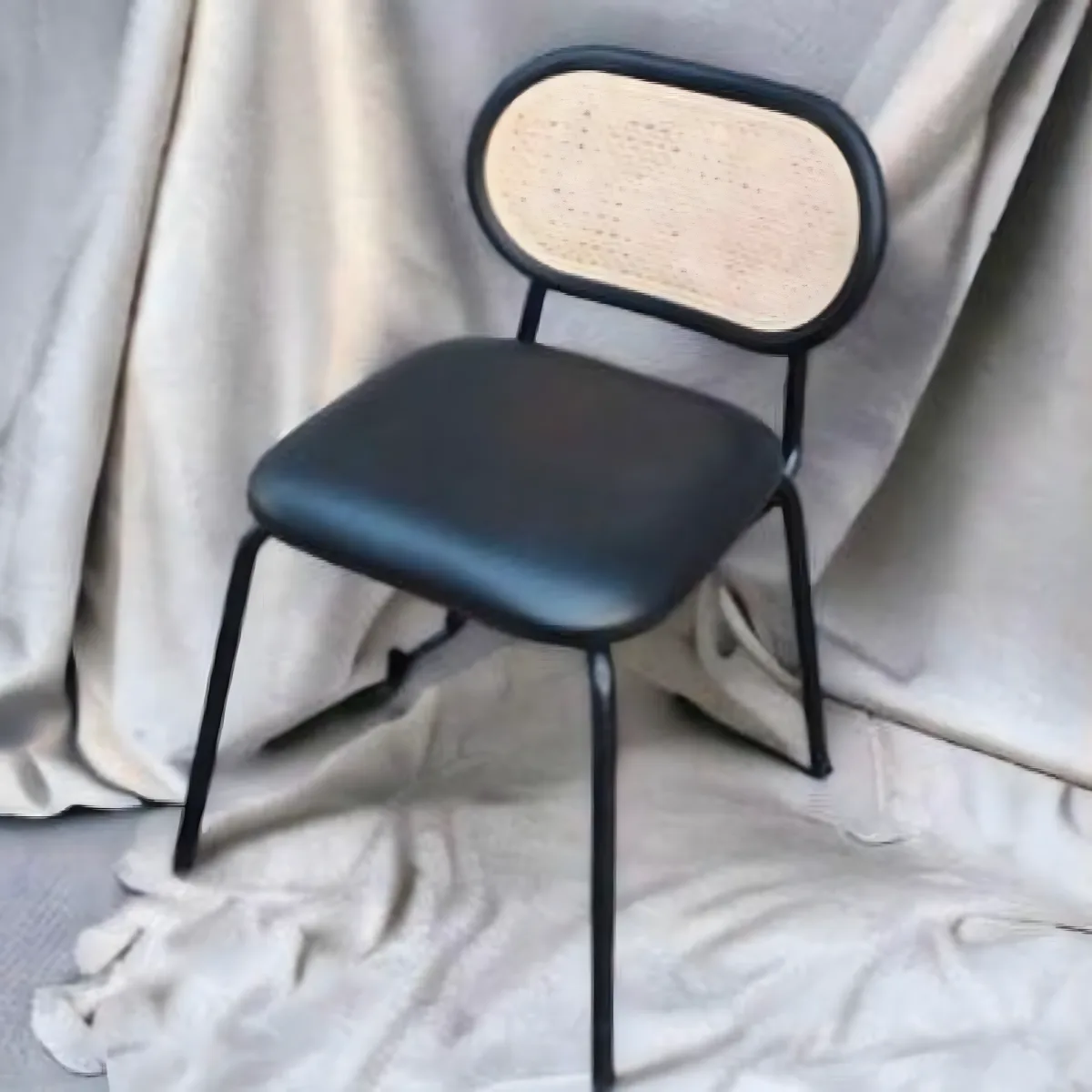 Oval Rattan Backrest Black Metal Dining Chair